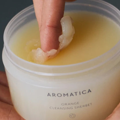 Aromatica Orange Cleansing Sherbet – a balm-to-oil cleanser with organic orange peel oil, designed to remove makeup, excess sebum, and impurities while hydrating the skin.